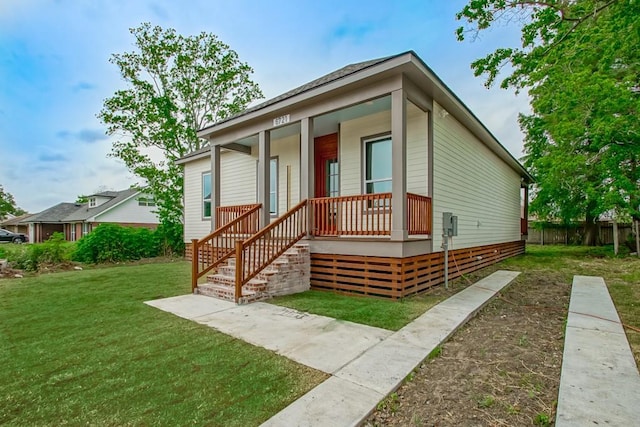 view of front facade with a porch and a front lawn