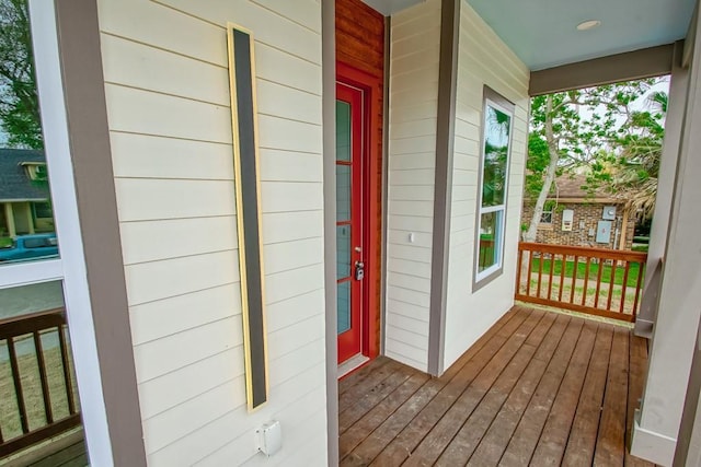 view of exterior entry with covered porch