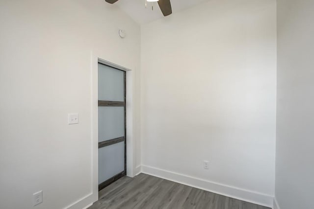 unfurnished bedroom featuring hardwood / wood-style flooring and ceiling fan