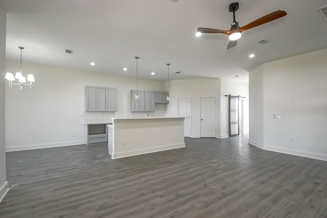 6721 Manchester St, New Orleans, LA 70126 - unfurnished living room featuring recessed lighting, dark wood-type flooring, a ceiling fan, and a chandelier