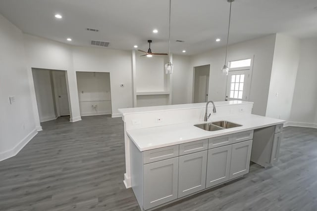 6721 Manchester St, New Orleans, LA 70126 - kitchen featuring gray cabinetry, recessed lighting, a ceiling fan, an island with sink, and dark wood-style flooring