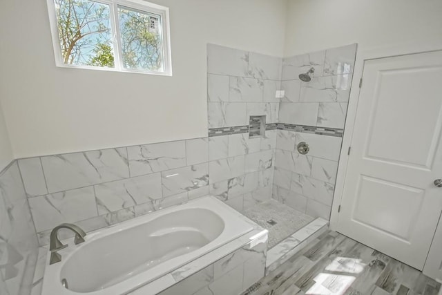 6721 Manchester St, New Orleans, LA 70126 - bathroom featuring a garden tub and tiled shower
