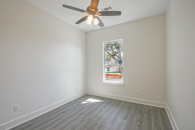 spare room featuring ceiling fan and hardwood / wood-style floors