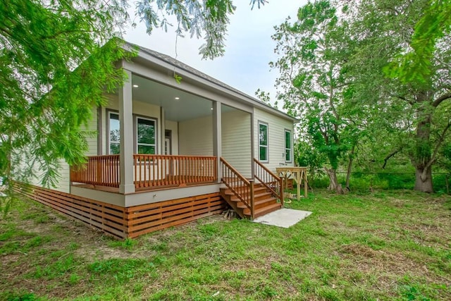 6721 Manchester St, New Orleans, LA 70126 - back of property with covered porch and a yard