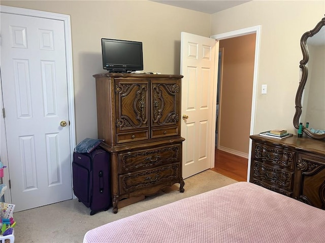 bedroom with light colored carpet