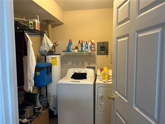 washroom featuring washer and dryer, laundry area, and water heater