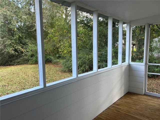 unfurnished sunroom with plenty of natural light