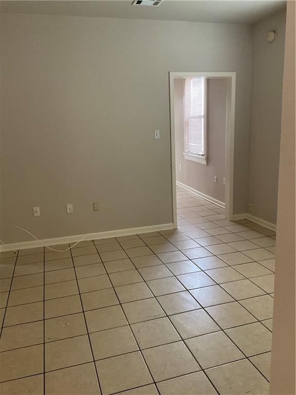 view of tiled spare room