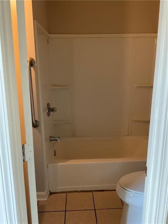 bathroom with tile patterned floors and toilet