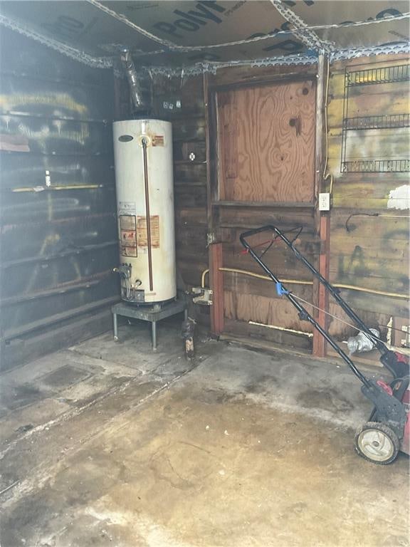 utility room featuring water heater