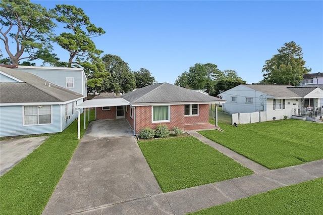 bungalow featuring a front lawn and a carport