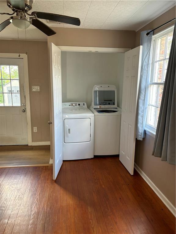 610 W Dr, Westwego, LA 70094 - laundry room with washer and dryer, baseboards, a ceiling fan, and dark wood finished floors