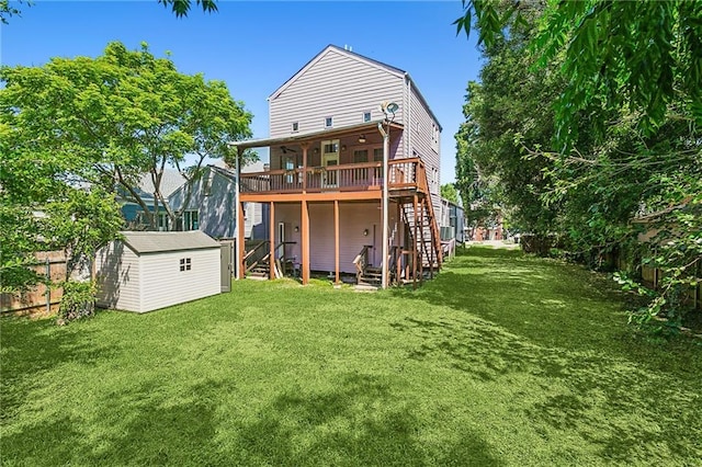 back of property with a yard, a storage shed, and a wooden deck