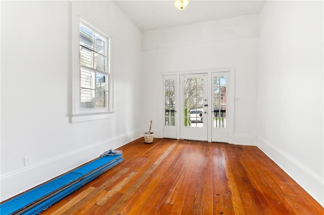 spare room with hardwood / wood-style flooring