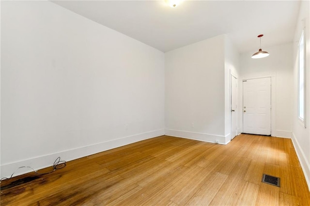 empty room with wood-type flooring