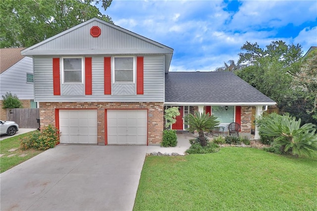 view of front of property featuring a garage and a front lawn