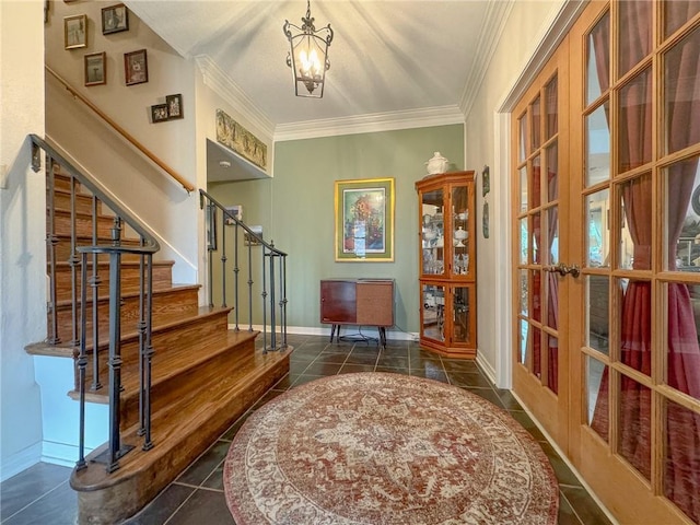 tiled entrance foyer featuring ornamental molding and french doors