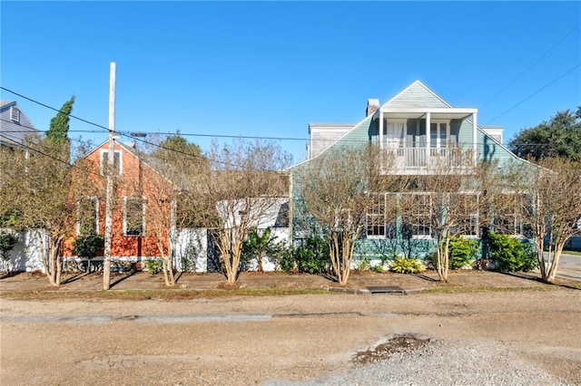 view of front of house with a balcony