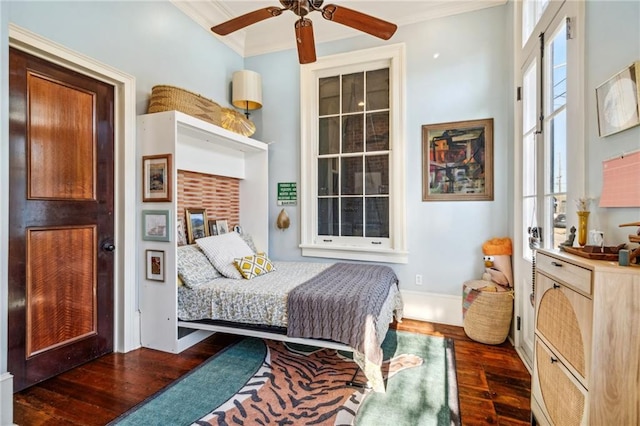 bedroom featuring crown molding, ceiling fan, and dark wood-type flooring