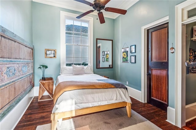 bedroom featuring ceiling fan, dark hardwood / wood-style flooring, and ornamental molding