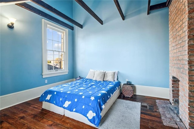 bedroom featuring vaulted ceiling with beams and dark wood-type flooring