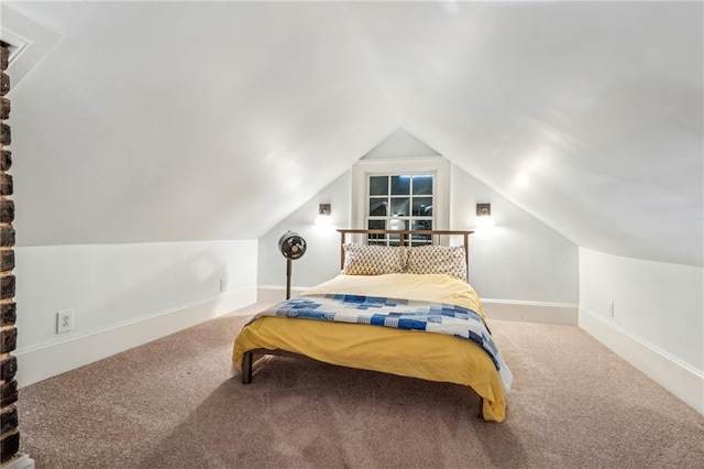 bedroom with carpet and lofted ceiling