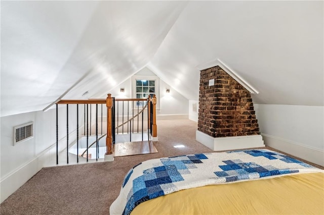 bedroom with carpet flooring and vaulted ceiling