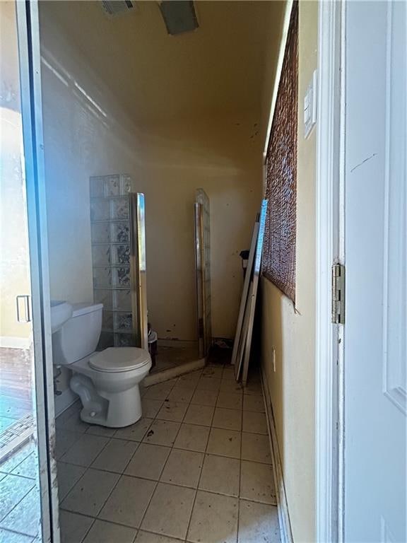 bathroom with tile patterned floors and toilet