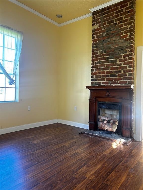 unfurnished living room featuring dark hardwood / wood-style floors, a brick fireplace, and crown molding