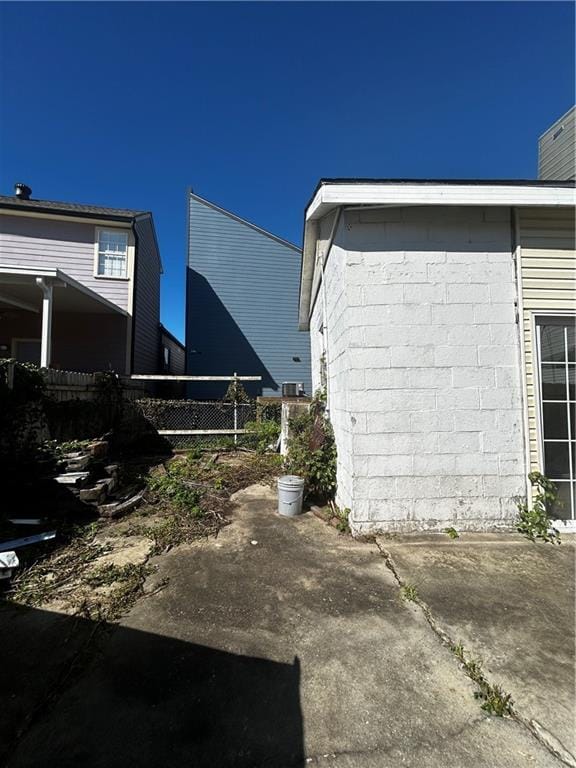 view of side of property with a patio