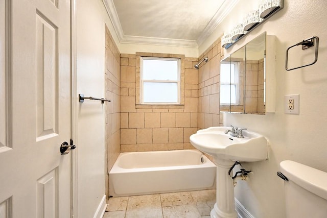 bathroom with tiled shower / bath combo, toilet, and crown molding