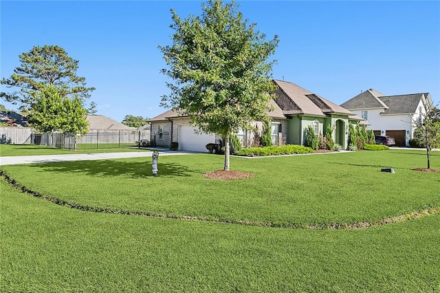 view of front facade featuring a garage and a front lawn