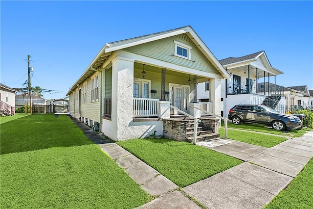 view of front of home featuring a front lawn and a porch