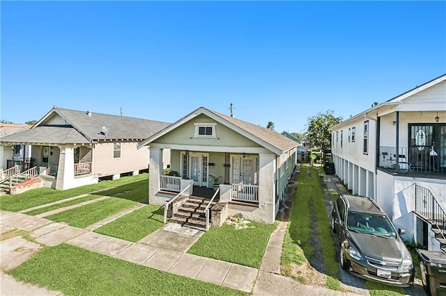 bungalow-style house featuring a front yard and a porch