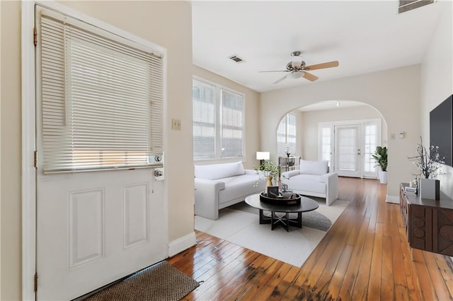 living room featuring ceiling fan and wood-type flooring