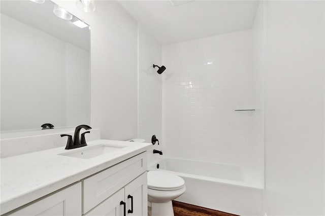 full bathroom with shower / bath combination, vanity, hardwood / wood-style flooring, and toilet