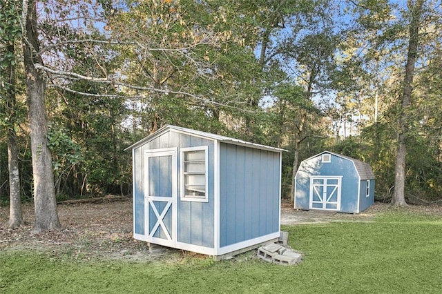 view of outbuilding featuring a yard