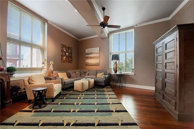 living area with baseboards, crown molding, ceiling fan, and dark wood-style floors