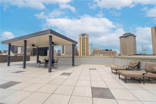 view of patio featuring ceiling fan and outdoor dining space