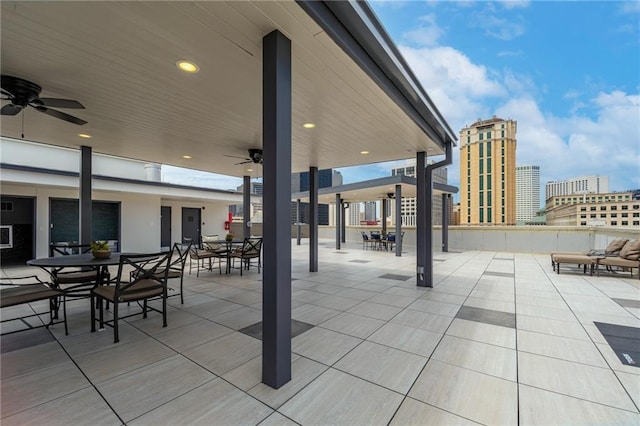 view of patio / terrace featuring outdoor dining area and a ceiling fan