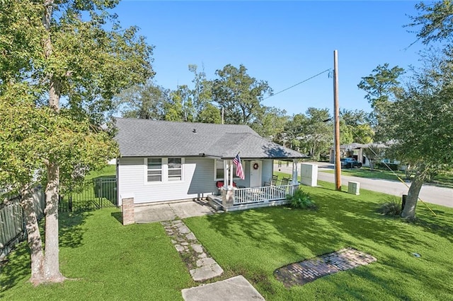 view of front of home featuring a front yard and a porch