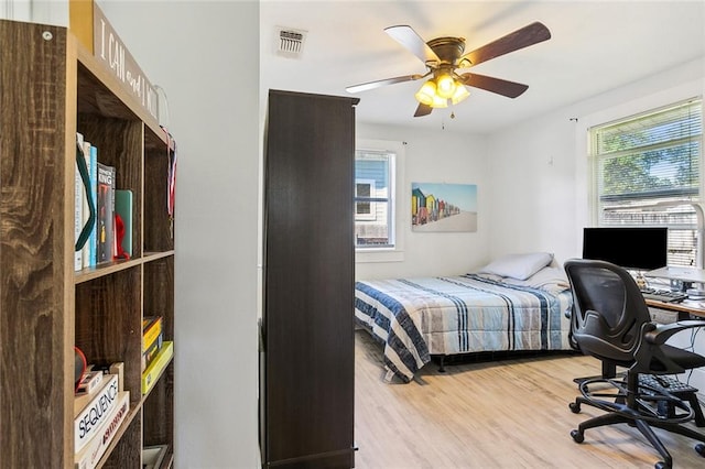 bedroom featuring ceiling fan and light wood-type flooring