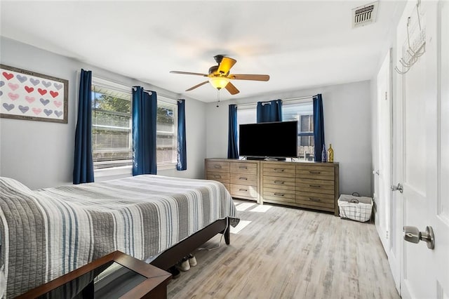 bedroom featuring ceiling fan and hardwood / wood-style floors