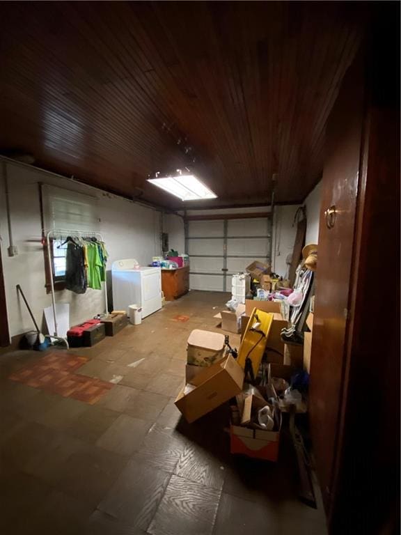 garage with wooden ceiling and separate washer and dryer