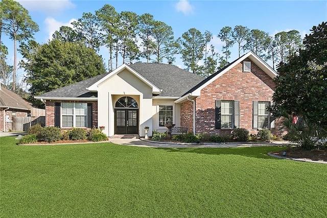 ranch-style home featuring french doors and a front lawn