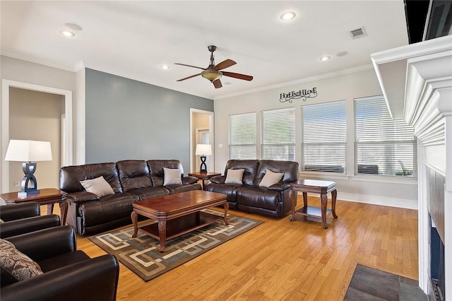 living room with ceiling fan, light hardwood / wood-style flooring, and ornamental molding