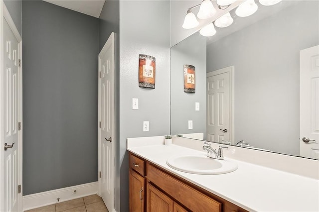 bathroom featuring tile patterned flooring and vanity