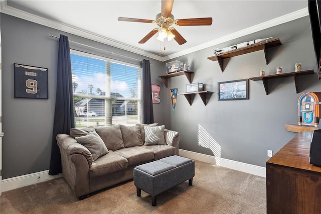 carpeted living room featuring ceiling fan and crown molding