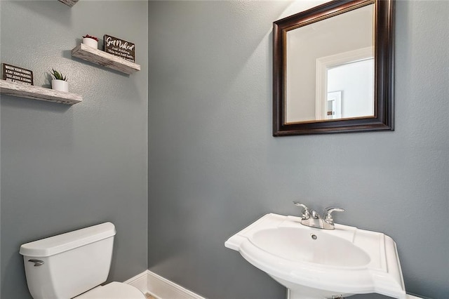 bathroom with toilet and sink