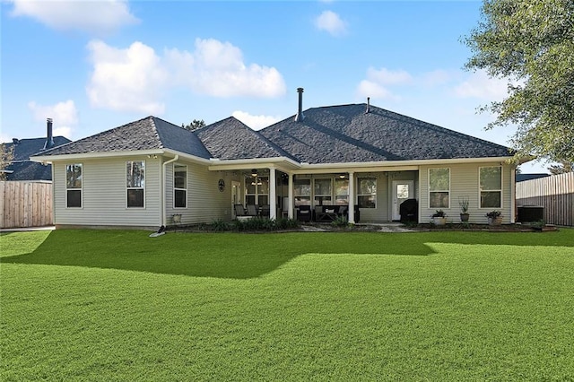 back of house featuring a yard